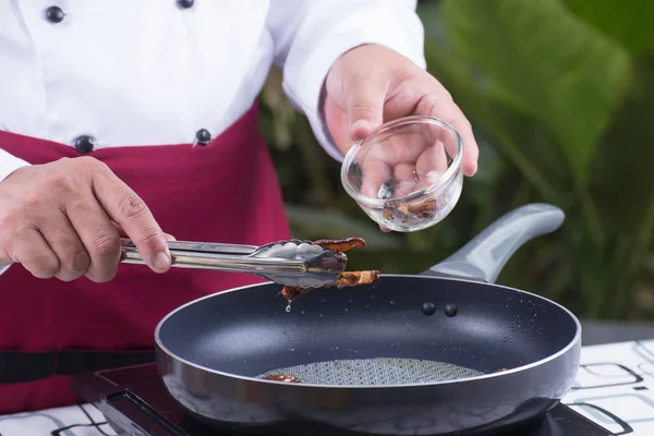 Chef putting mushroom  to the pan — Stock Photo, Image