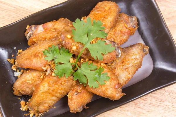 Fried chicken wings on plate