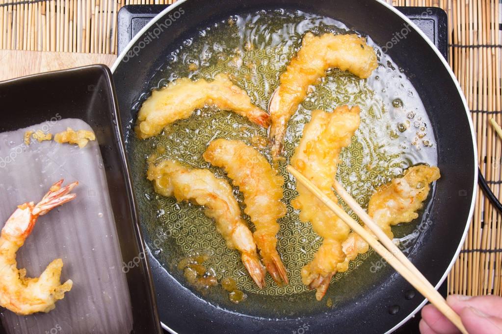 Chef putting frying shrimp Tempura to the plate — Stock Photo © kung
