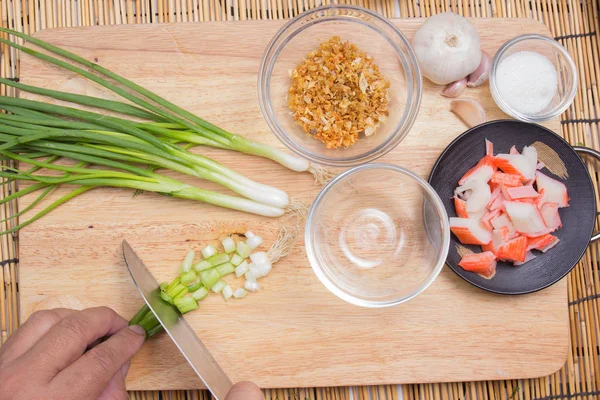 Chef cutting green onion  before cooking — Stock Photo, Image