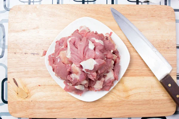 Chef slicing beef before cooking — Stock Photo, Image