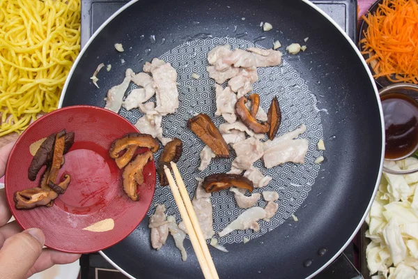 Chef stir fried slice of mushroom in pan — Stock Photo, Image