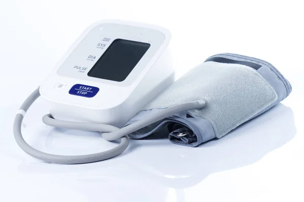 Digital blood pressure monitor on the white background Stock Image