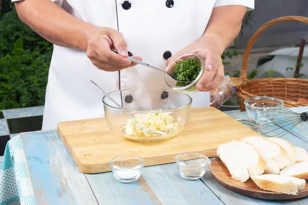 Chef Putting Minced Parsley Bowl Cook Garlic Bread Cooking Garlic — Stock Photo, Image