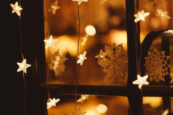 Christmas garland of lights and stars — Stock Photo, Image