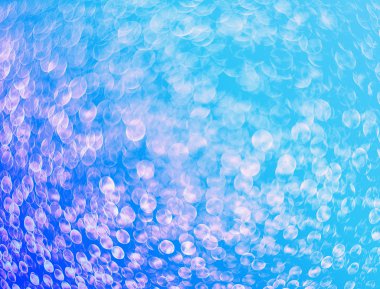 Turkuaz arka planda parlayan su damlaları