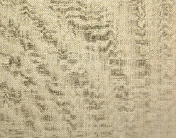 Textured  background of beige natural textile
