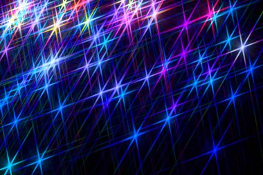 Karanlık arka planda parlayan yıldızlar