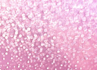 Pink background with shining drops of water