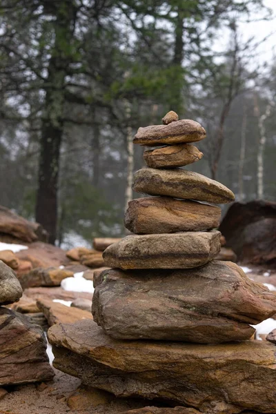 Cairn Building in forest