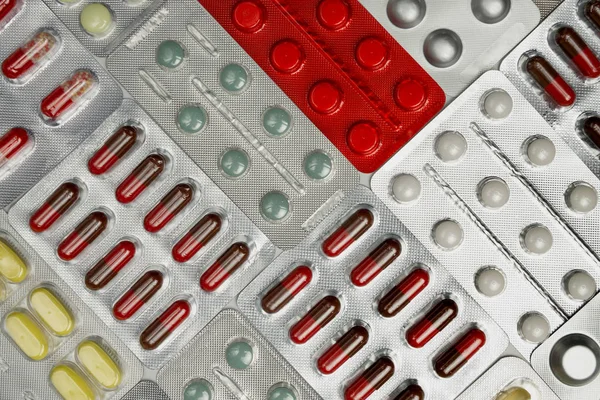 Flerfärgade piller, kapslar och vitaminer låg — Stockfoto