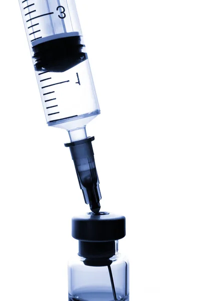 Glass medical ampoule for vaccination and disposable plastic syringe with on a white background — Stok fotoğraf