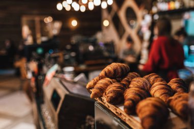 close up view on fresh croissants in coffee shop