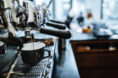 View on barista making coffee in coffee shop