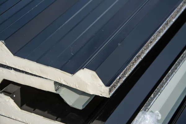 Black metal sheet  roof with insulation attached under metal sheet. — Stock Photo, Image