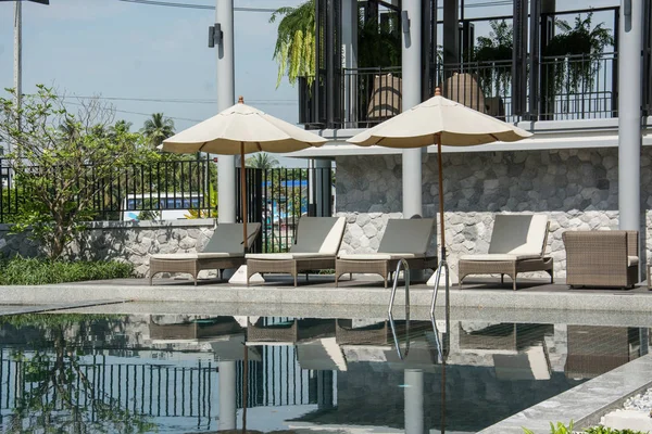 Relaxing rattan  beside at the swimming pool. — Stock Photo, Image