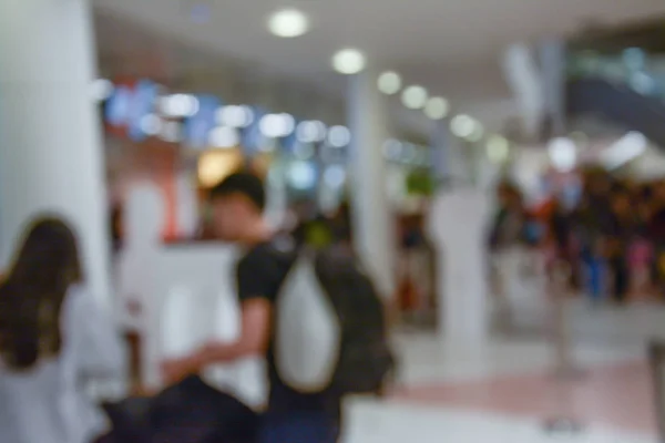 Abstract blur image of people walk in the airport