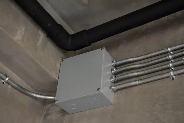Electrical junction box with galvanized conduit pipe connection — Stock Photo, Image