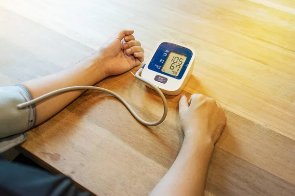 Checking the blood pressure with a modern digital equipment — Stock Photo, Image