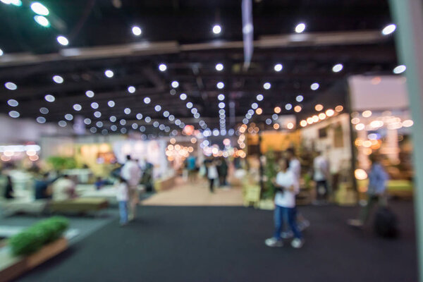 Abstract people walking in exhibition blurred background