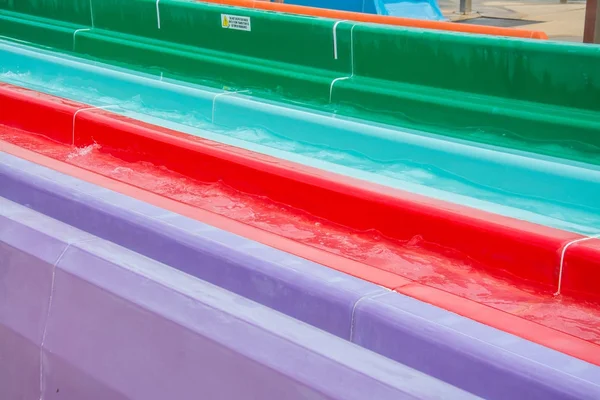 Colorful plastic water-slide in swimming pool — Stock Photo, Image