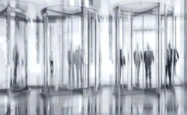 Group of people in the lobby business center in monochrome blue — Stock Photo, Image