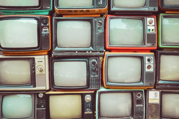 Parede de pilha colorido retro televisão — Fotografia de Stock