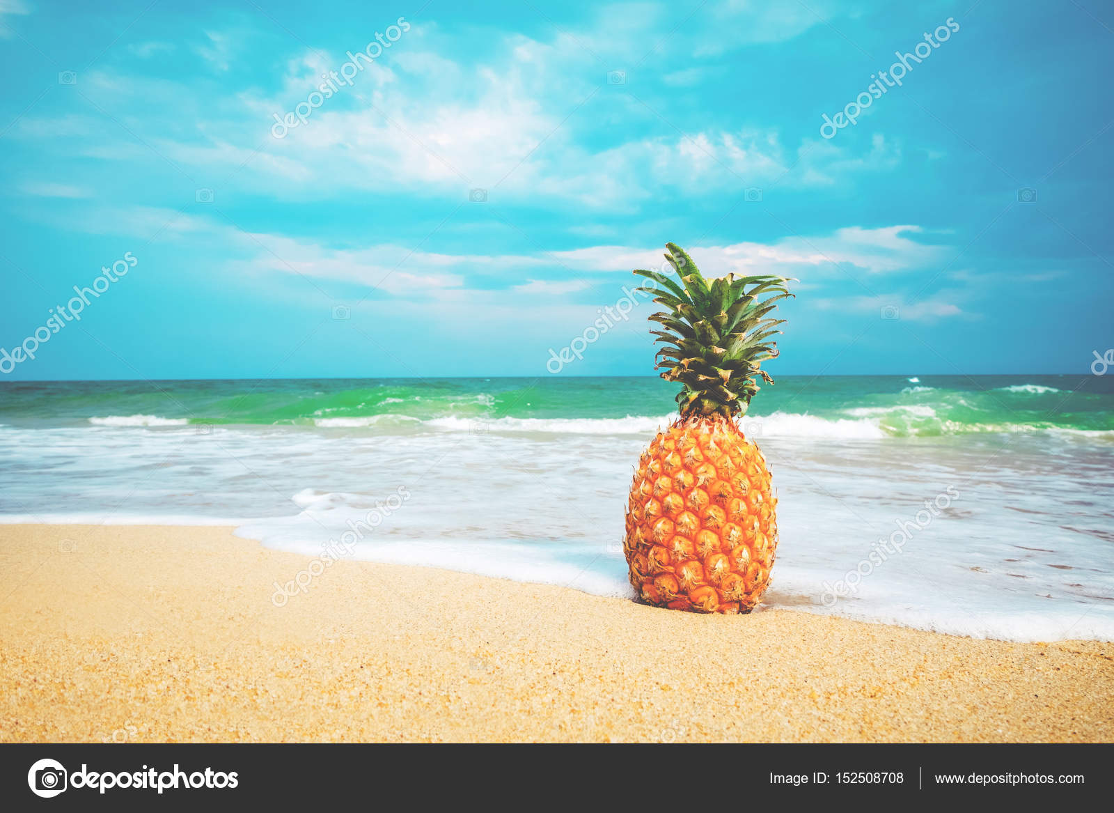 Ripe pineapples on the sandy tropical beach — Stock Photo © jakkapan