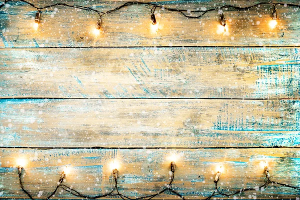 Christmas lights bulb on wood table — Stock Photo, Image