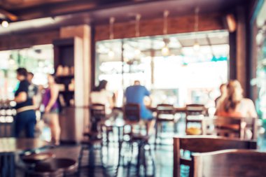 Coffee shop arka plan bulanık görüntü. kafede insanlarla arka plan bulanıklık. Vintage renk tonu stili