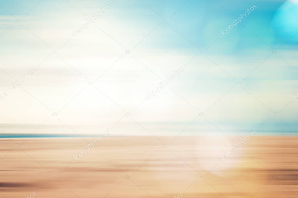 A seascape abstract beach background. panning motion blur and bokeh light of lens flare, pastel colors in a vintage and retro style.