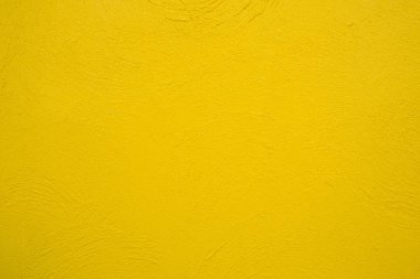 Boş sarı beton duvar, temiz doku arka plan yüzeyi.