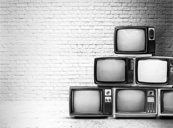 Retro Televisores Amontonan Suelo Habitación Vieja Con Pared Blanca Antiguo —  Fotos de Stock