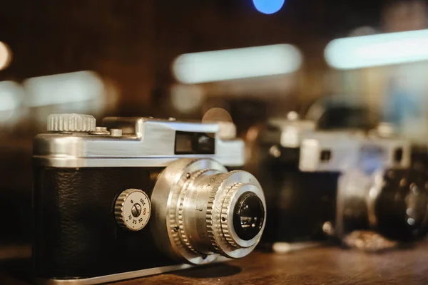 Vintage film camera, collectibles. retro photography equipment. vintage color tone.