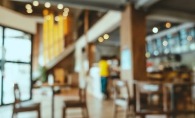 Kafenin arka planı bulanık, Bokeh 'le birlikte modern bir kafeterya. Klasik filtre efekti.