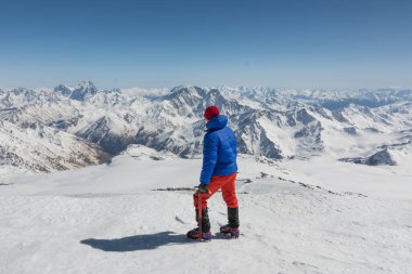 Caucasus / Russia - 22.04.2018 Group of climbers climbing mountain peaks.