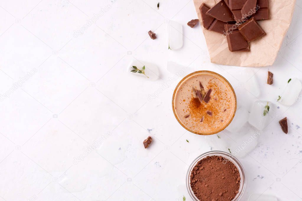 Lassi chocolate is a traditional Indian cold drink next to cocoa, chocolate and ice. there is a place for text