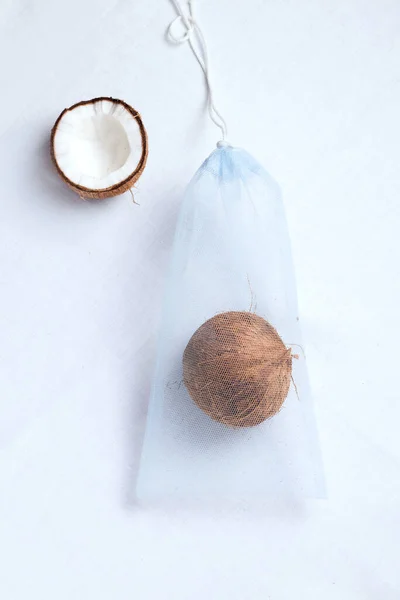 Grocery eco bag with fresh coconut. white background. zero waste concept — Stok fotoğraf