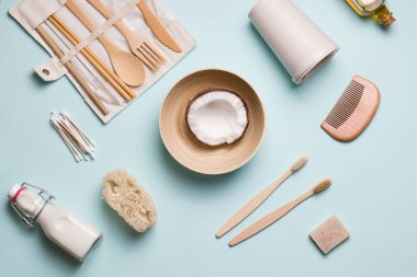 layout of environmentally friendly accessories for the bathroom and kitchen on a blue background. zero waste concept