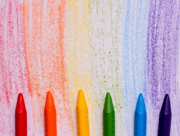 The concept of drawing lessons. Crayons of rainbow colors. Copy space
