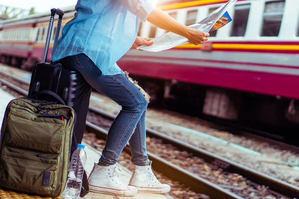 Solo backpacker traveler plan safety trip low cost budget summer holiday after coronavirus crisis. Empty tourist on train railway platform. Use bus train sustainable environmental friendly transport