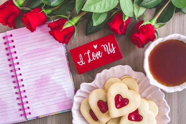 Jam filled Valentines Day heart cookies and tea