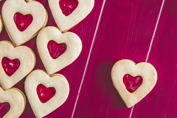 Jam filled Valentines Day heart cookies and tea — Stock Photo, Image