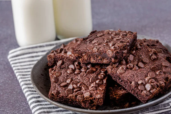 Close Plate Stacked Homemade Keto Chocolate Chip Brownies Two Bottles — Stock Photo, Image