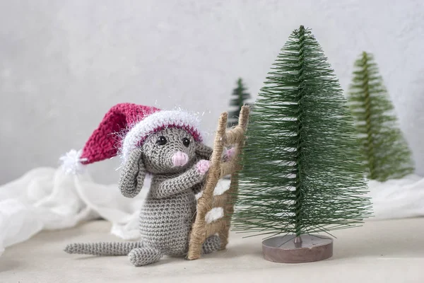 crocheted mouse with ladder and Christmas trees