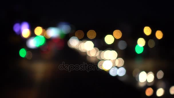 4K Bokeh of car lights. On the street at night Colorful Circles Video Background Loop Glassy circular shapes perform a colorful dance. motion background that is just — Stock Video