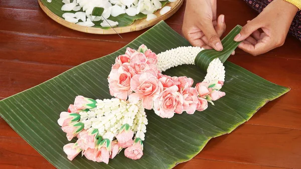 Made beautiful wedding garlands in hand on banana leaves and wood  nature
