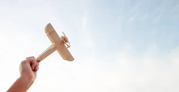 Freedom Concept Human Hand Holding Wooden Plane Sunset Sky Background Stock Image