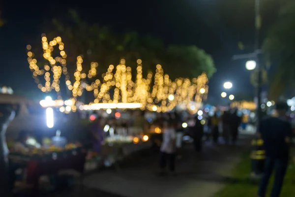 Blurred People and Blurred Lights in Loi Krathong Festival Thailand in Medium Shot