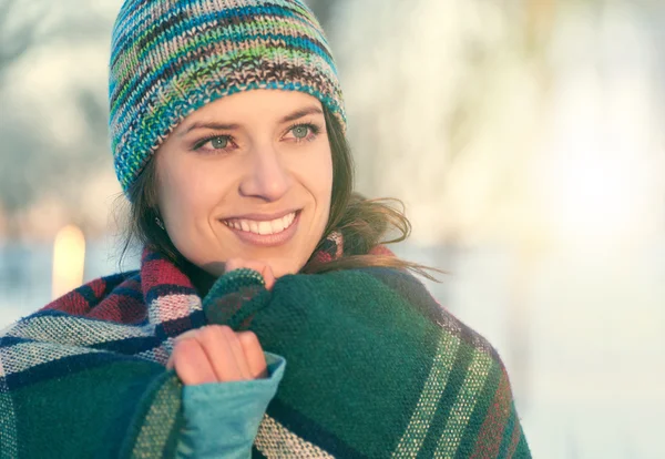 Attractive mixed race woman smilling in the snow — Stock Photo, Image